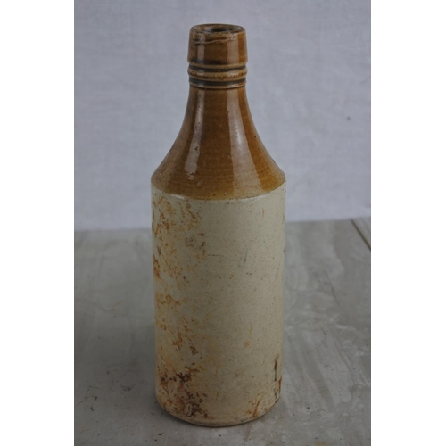 163 - An antique Andrew A Watt & Co Ltd, Londonderry stoneware beer bottle (a/f).