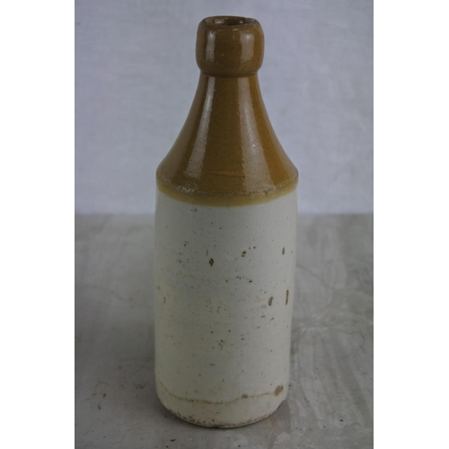 164 - An antique N McLoone & Co, Derry stoneware beer bottle.