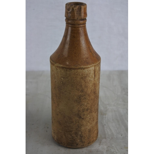 165 - An antique Andrew A Watt & Co Ltd, Londonderry stoneware beer bottle (a/f).