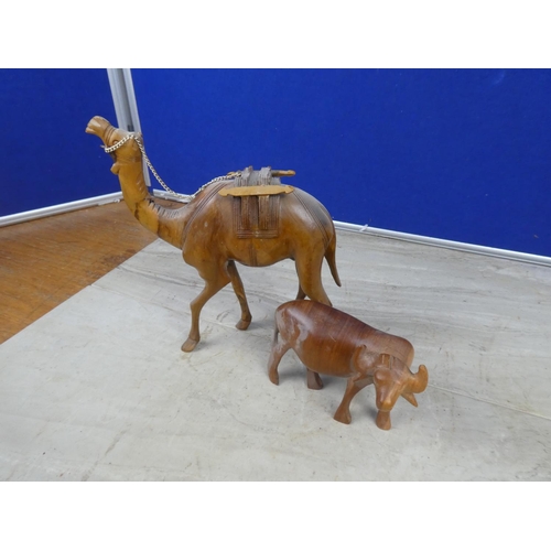 407 - A vintage wooden camel and bull.