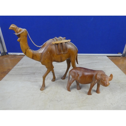 407 - A vintage wooden camel and bull.