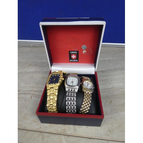 412 - A cased Swiss Sports wrist watch and two others.