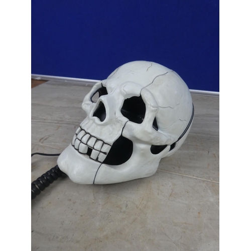 425 - A novelty skull telephone.