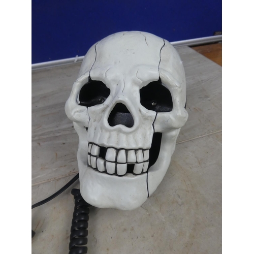 425 - A novelty skull telephone.