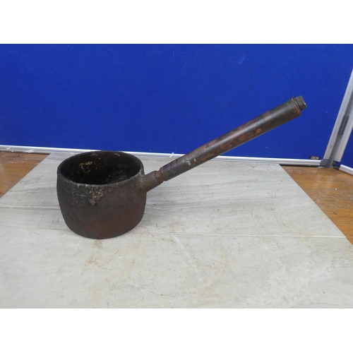 426 - A small antique saucepan with a copper handle.