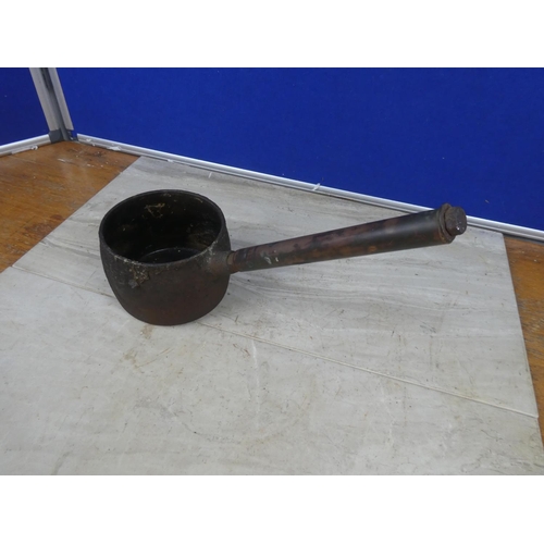 426 - A small antique saucepan with a copper handle.