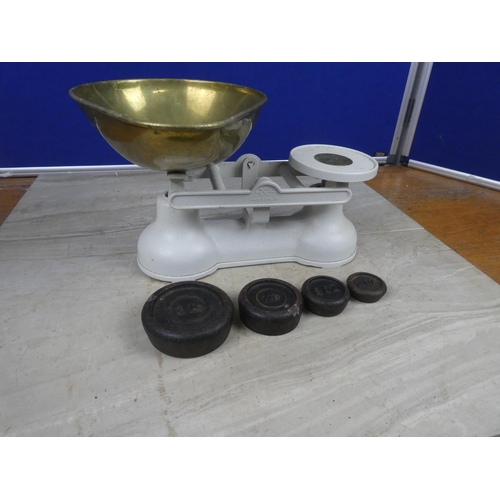 427 - A set of cream cast iron kitchen scales and brass weights.