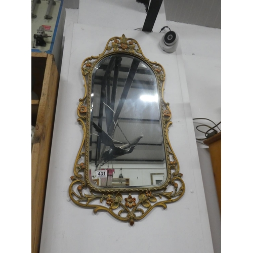 431 - A decorative framed wall mirror.  Approx 42x84cm.