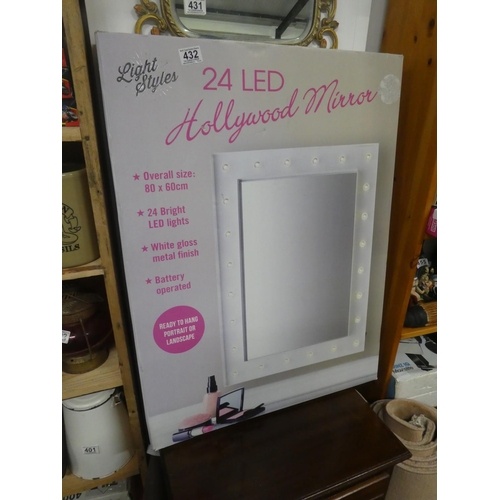 432 - A boxed LED light mirror.   Approx 80x60cm.