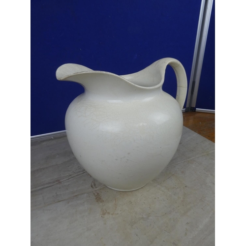 450 - A large ceramic jug.  Approx 26cm.