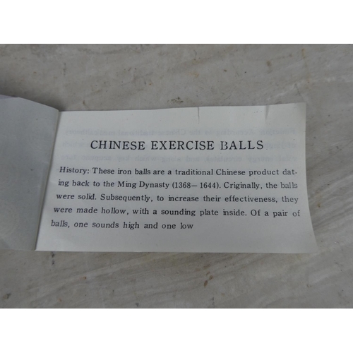 461 - A cased set of Chinese medicine balls.