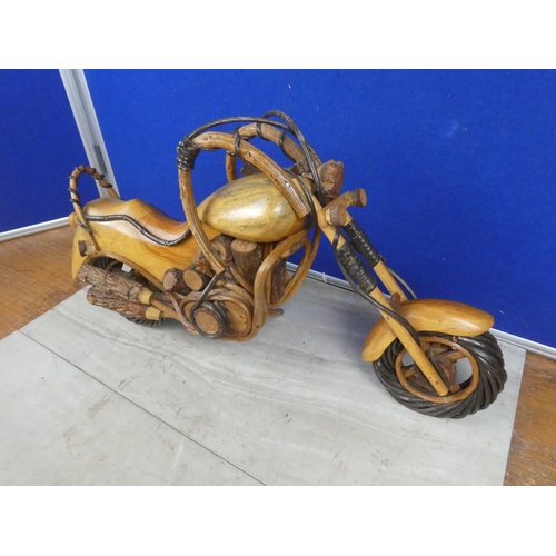 464 - A large wooden model of a motorbike.  Approx 50cm.