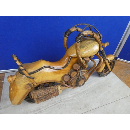 464 - A large wooden model of a motorbike.  Approx 50cm.