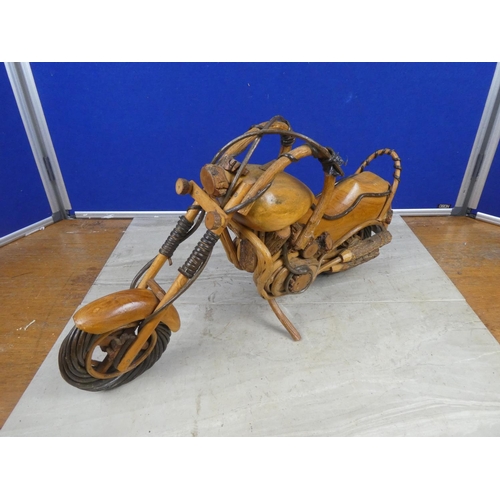 464 - A large wooden model of a motorbike.  Approx 50cm.