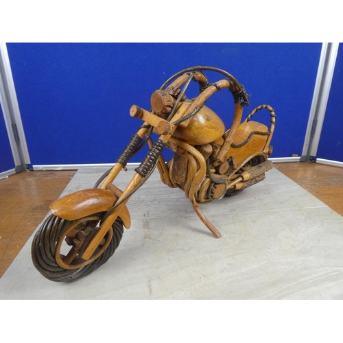 464 - A large wooden model of a motorbike.  Approx 50cm.