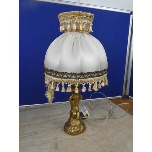 469 - A cherub based table lamp and shade.  Approx 43cm.