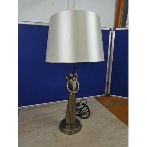 473 - A modern figurine based table lamp and shade.  Approx 55cm.