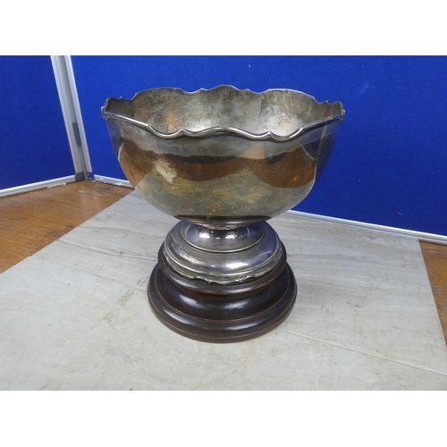 477 - A very large EPNS presentation bowl on wooden base.  Approx 25cm.