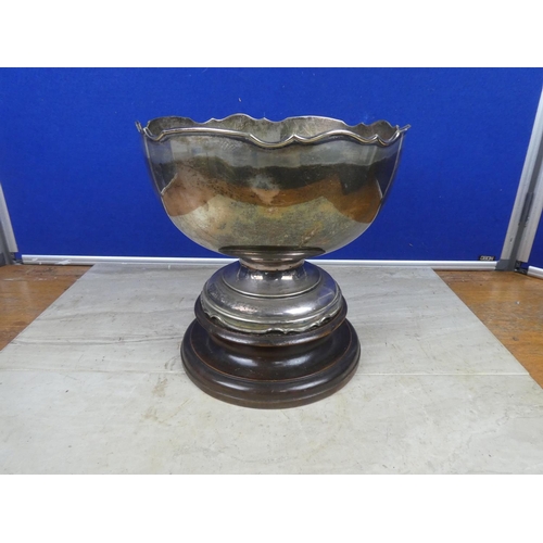 477 - A very large EPNS presentation bowl on wooden base.  Approx 25cm.