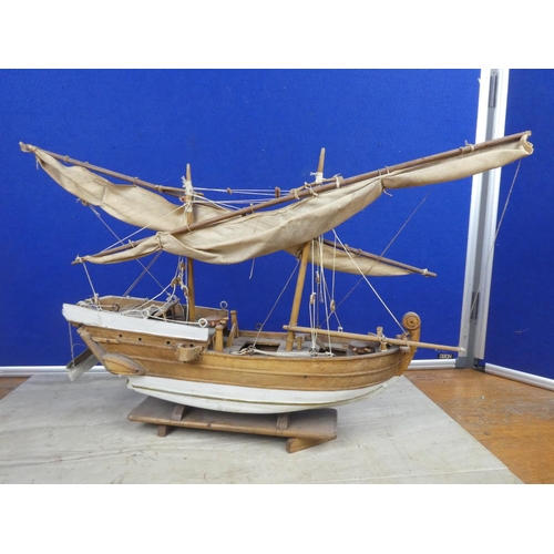 484 - A model wooden fishing boat.  Approx 52cm.