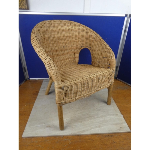 496 - A small rattan armchair.  Approx 55cm.