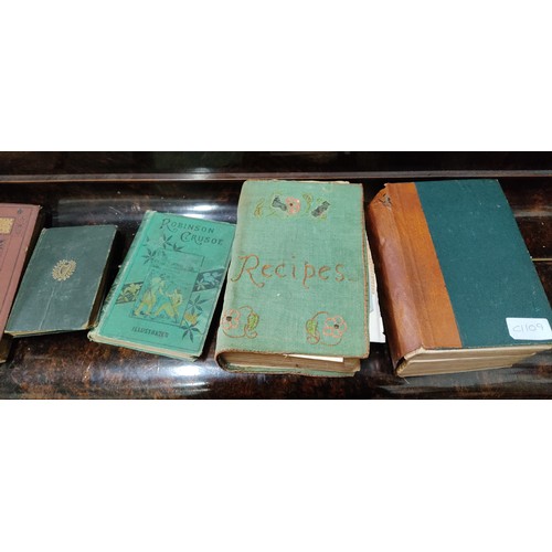 86 - An assortment of antique and vintage books.