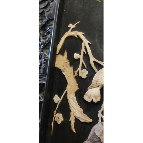 267 - A Japanese style inlaid lacquer panel, decorated with bone and pearl. (A/F)  Approx 50x75cm.