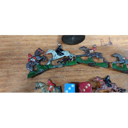 326 - A stunning antique horse racing game with various lead figures, wooden cup & dice.