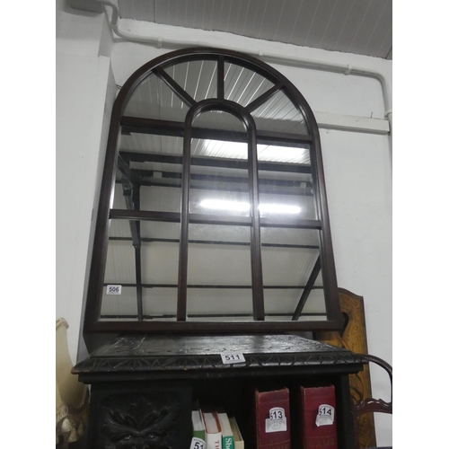 506 - A large wooden framed arch top mirror.  Approx 74x104cm.