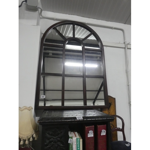 506 - A large wooden framed arch top mirror.  Approx 74x104cm.