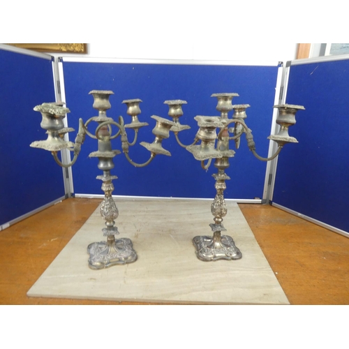 507 - A pair of vintage heavy silver plated candelabras.  Approx 45cm.