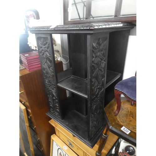 511 - A rare antique painted oak revolving bookstand with hand carved 'Green Man' panels.