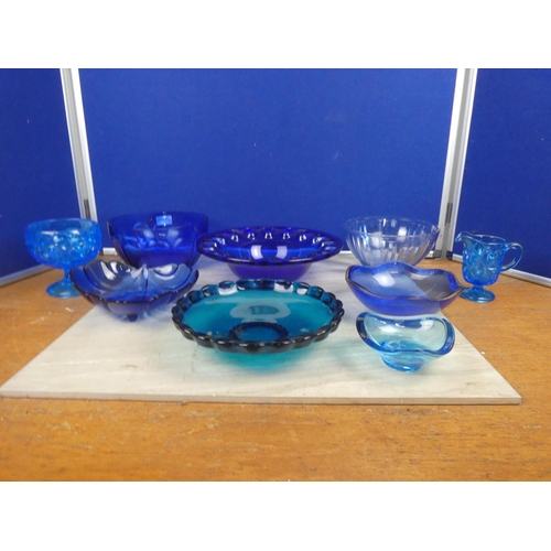 522 - A collection of vintage blue glass ware.