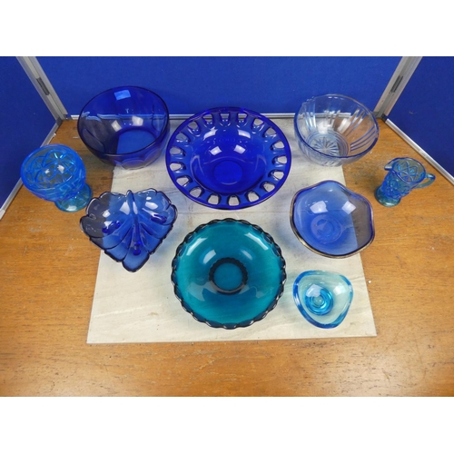 522 - A collection of vintage blue glass ware.