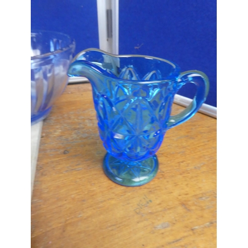 522 - A collection of vintage blue glass ware.