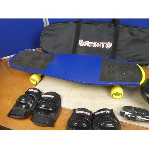 540 - A Skaight skateboard, helmet and bag.