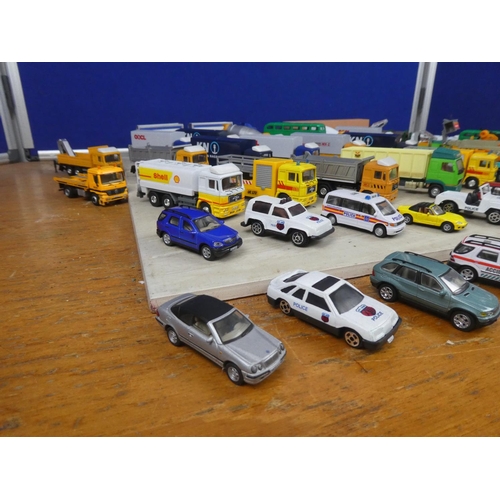 547 - A large box of assorted toy vehicles.