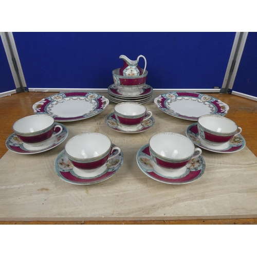 548 - A vintage bone china tea set decorated with cherub figures.