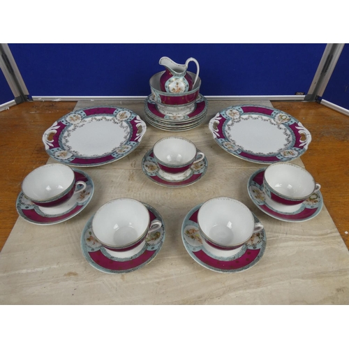 548 - A vintage bone china tea set decorated with cherub figures.