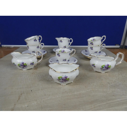 553 - A stunning Royal Standard 'Sweet Violets' bone china coffee set.