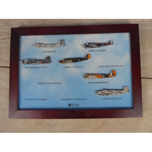 555 - A framed picture of military war planes (a/f).  Approx 25x17cm.