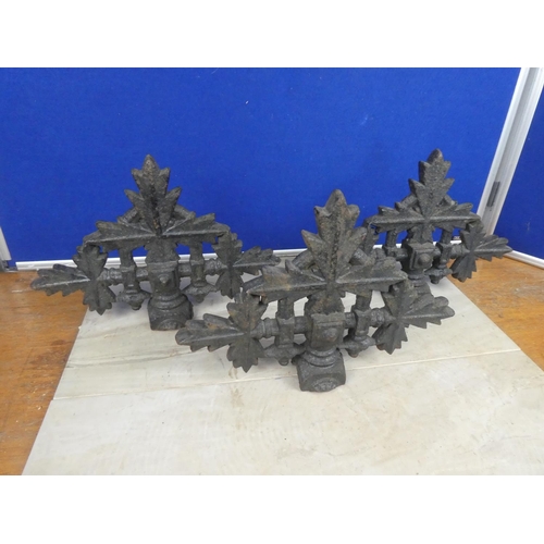 579 - Three antique cast iron post tops.