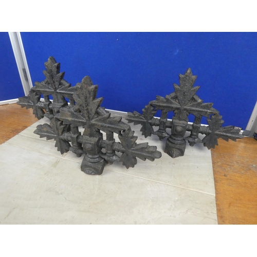 579 - Three antique cast iron post tops.