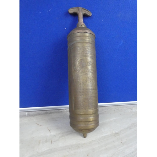 582 - An antique brass Pyrene fire extingusher.