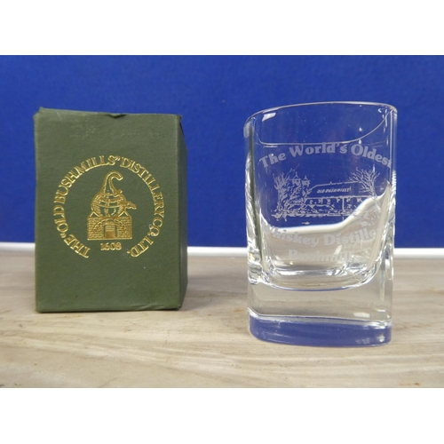 583 - A Drumcree badge and ribbon and a boxed Bushmills Distillery glass.