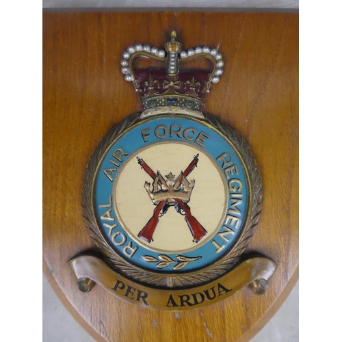 589 - A wooden wall plaque 'Royal Air Force Regiment'.  Approx 15x18cm.