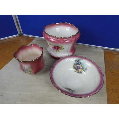 594 - A Staffordshire Ironstone plant pot decorated with flowers and more.