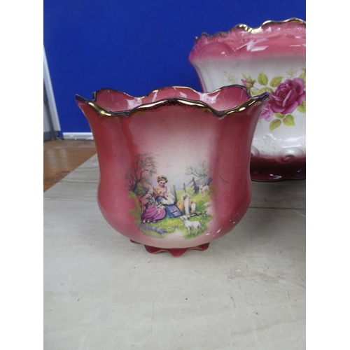 594 - A Staffordshire Ironstone plant pot decorated with flowers and more.