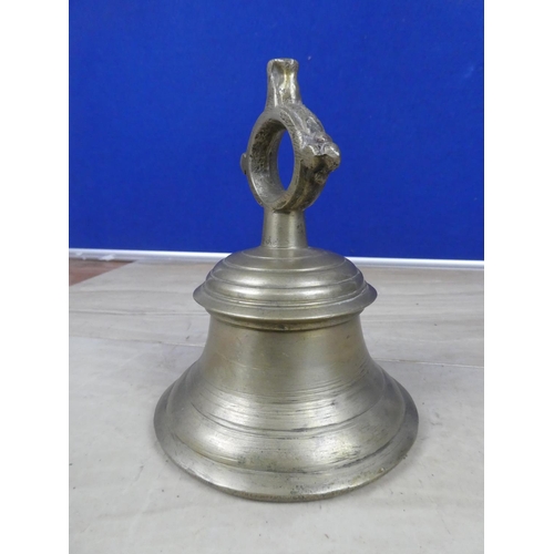 598 - An antique cast metal bell, inscribed 24.