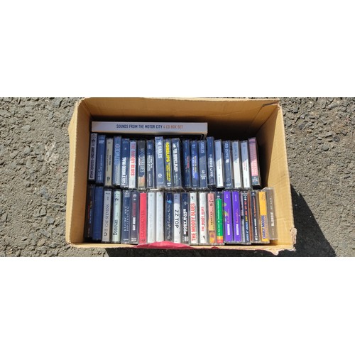 350B - A large collection of 90 vintage cassette tapes to include artist such as Queen, Guns and Roses, ZZ ... 